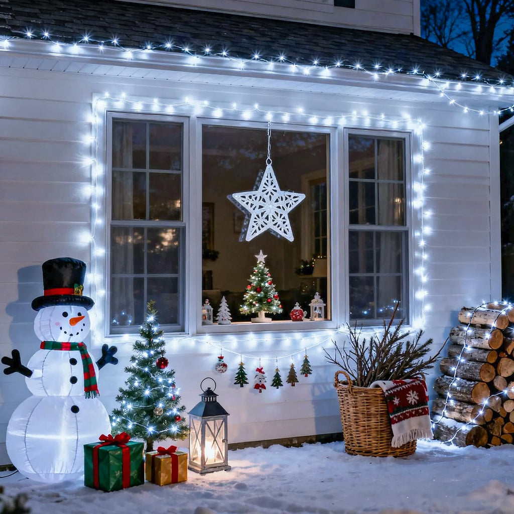 Cool White 100 LED battery string lights outlining a house facade for Christmas