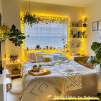Warm white 100 LED battery string lights along a master bedroom window and wall