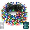 Multicolor 100 LED battery string lights on dark green wire coiled with remote and waterproof battery case