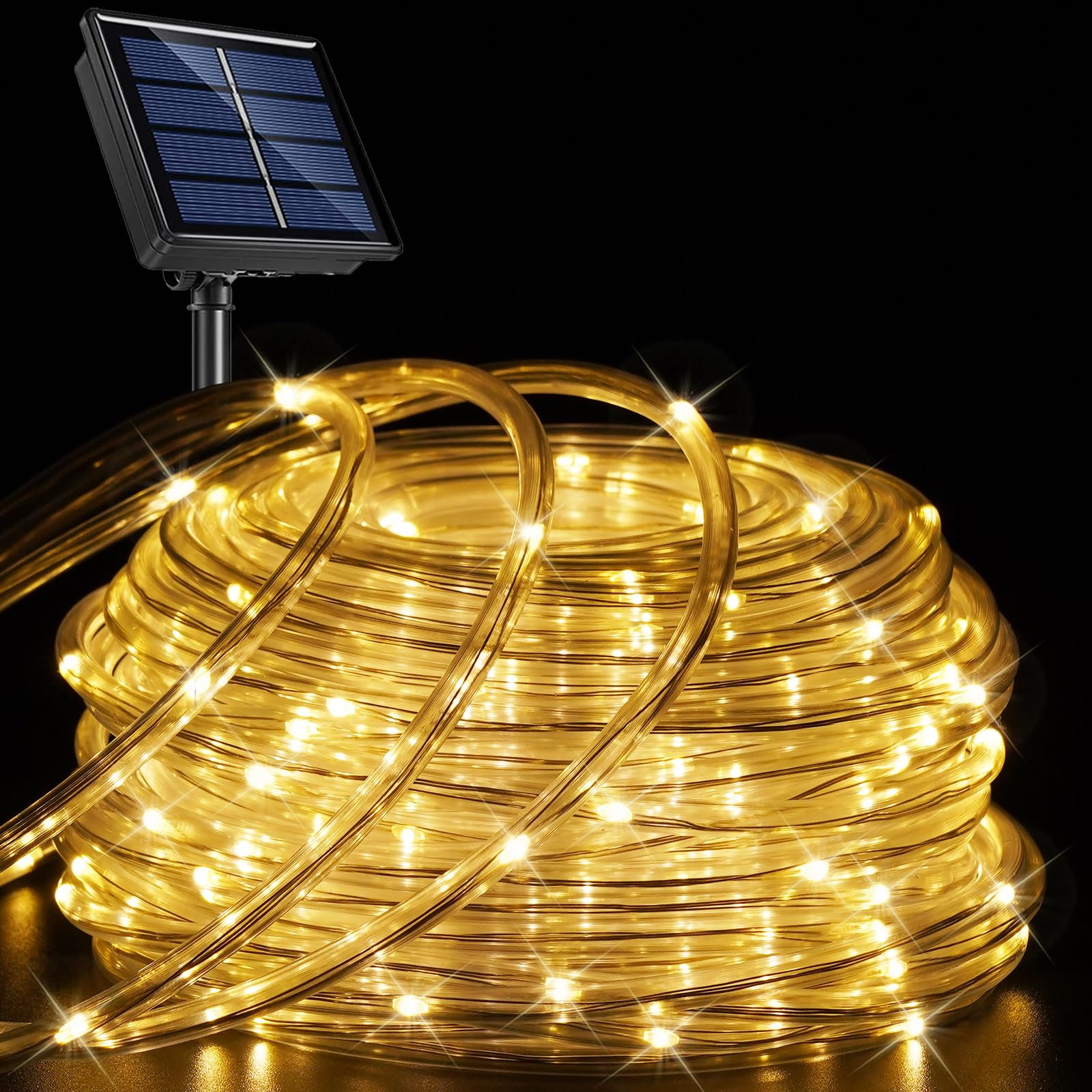 Warm White solar rope lights coiled with solar panel on black background