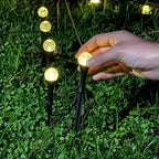 Easy installation of solar bubble ball garden stake lights — simply push the spike into ground, no wiring needed