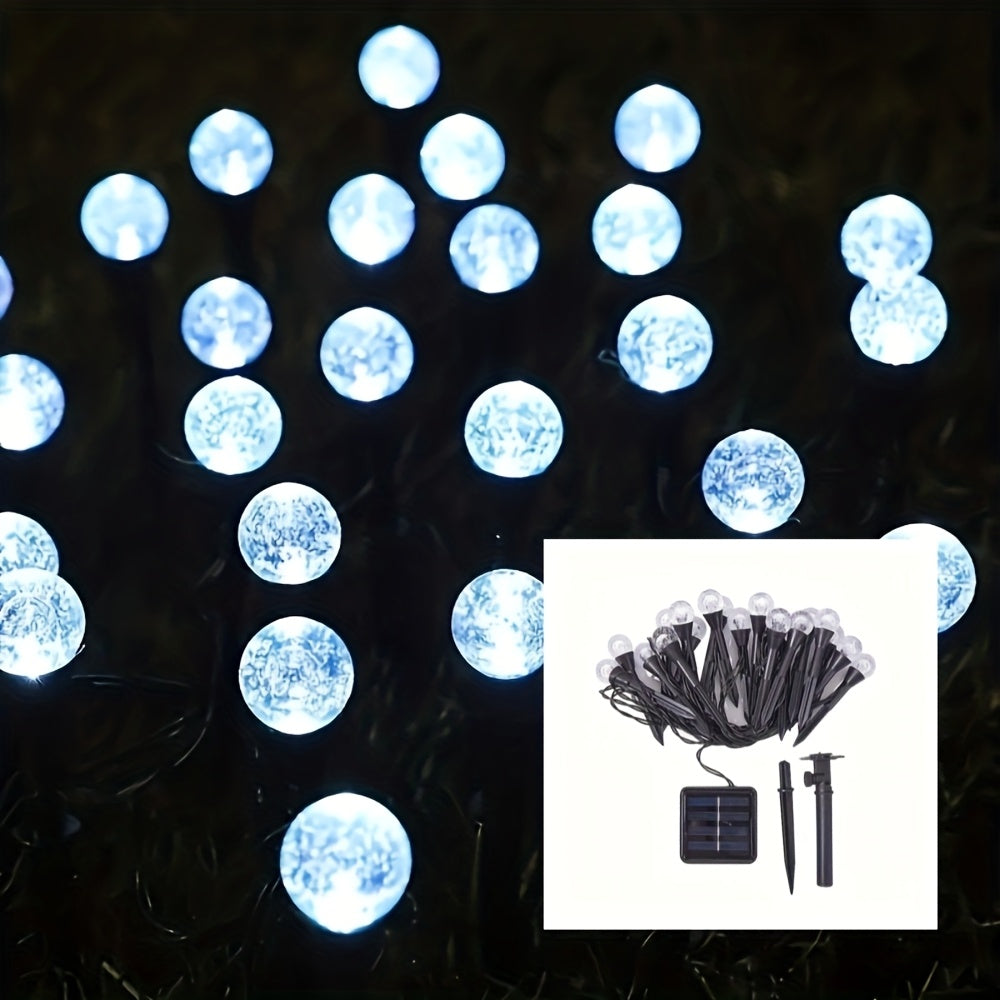 Cool white solar crystal bubble ball garden stake lights on white background