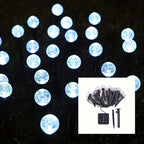 Cool white solar crystal bubble ball garden stake lights on white background