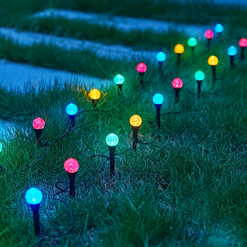Cool white solar stake lights illuminating pathway at night