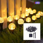 Warm white solar stake lights decorating patio at night